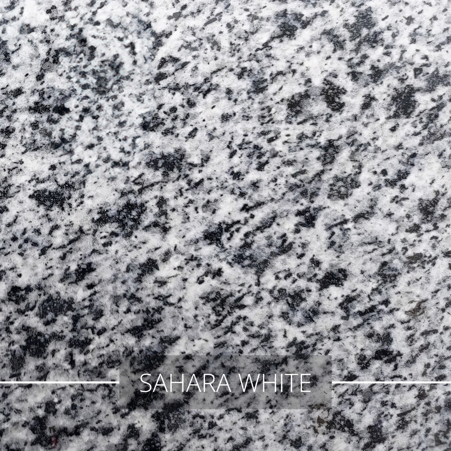 Biały granit z grubymi, czarnymi minerałami Sahara White